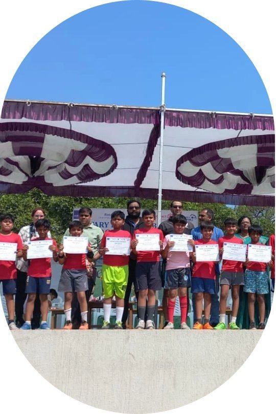 Students receiving certificates at a school assembly