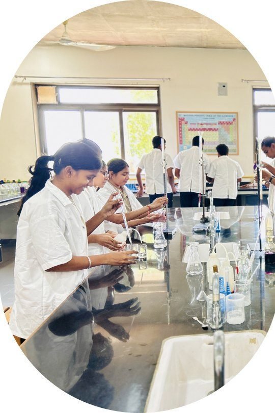 Students working with apparatus in the chemistry lab